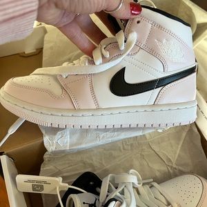 Air Jordan’s dusty rose with black Nike logo